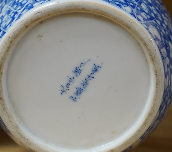 A Japanese Seto blue and white lidded ginger jar, 24cm high. Condition - lid poor (repaired in Kitsugi fashion with staples and filler visible to interior) body fair with one visible star crack.